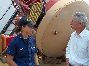 In July, Ensign Rachel Post, USCG, explains the duties aboard the U.S. Coast Guard Cutter Willow to Bob Kelly, chapter member.